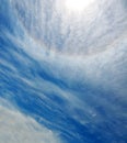 Sun halo in blue sky with clouds Royalty Free Stock Photo