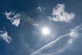 Sun halo blue sky and clouds