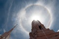 Sun halo or corona phenomenon in cloudy and blue the sky. Royalty Free Stock Photo