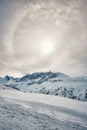 Sun halo over snowy mountains in the French Alps Royalty Free Stock Photo