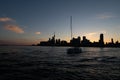 Sailboat Crossing the Toronto Skyline at Sunset Royalty Free Stock Photo