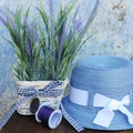 Sun hat and lavender flowers against old cracked wall in Greece Royalty Free Stock Photo