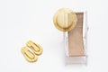 Sun hat on sunbed and pair of sandals on sandy beach. Copy space. Royalty Free Stock Photo