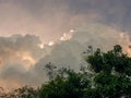 The sun hidden behind dense cumulus clouds Royalty Free Stock Photo