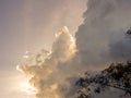 The sun hidden behind dense cumulus clouds Royalty Free Stock Photo