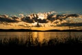 Sun hiding behind the clouds, during a beautiful sunset above the Hudson River, Tarrytown, Upstate New York, NY