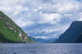 Sun hits mountain at fjord