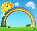 Sun holding rainbow on blue sky Royalty Free Stock Photo