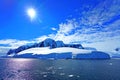 The sun hung in the sky and the melting snow from the icebergs exposed the rocks. Summer in Antarctica seems very hot.