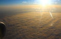 The sun illuminates the clouds, view from altitude