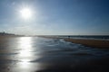 The sun illuminates the deserted beach of the cold North Sea in Belgium