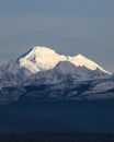 Sun illuminates the volcanic peak of Mount Baker in the North Cascades Royalty Free Stock Photo
