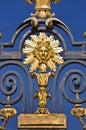 The Sun king, detail of the metal gate of the Chateau de Versailles, Paris Royalty Free Stock Photo