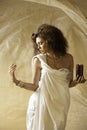 Sun kissed goddess with holding a burning candle Royalty Free Stock Photo