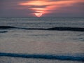 Sun kissing the ocean at sunset at Kuta Bali