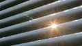 Sun lens flare through window louvers