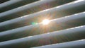 Sun lens flare through window louvers