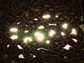 Sun light beams through floral window mosaics at Isfahan mosque