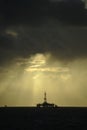 Sun light beams over Oil platform Royalty Free Stock Photo