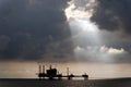 Sun light beams over Oil platform Royalty Free Stock Photo