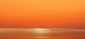 Sun light flares on orange sunset  sky and  sea  water summer nature landscape Royalty Free Stock Photo