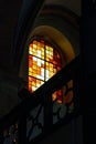 Sun light through the leaded pane in old majestic church