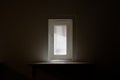 Sun light through window into dark room. Royalty Free Stock Photo