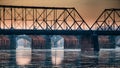 Sunrise through the arches of a series of bridges over the Susquehanna River in Harrisburg, PA Royalty Free Stock Photo