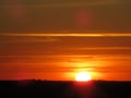 sun like fireball in a red lit sunset Royalty Free Stock Photo