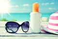 Sun lotion and sunglasses Royalty Free Stock Photo