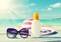 Sun lotion and sunglasses Royalty Free Stock Photo