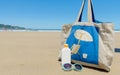 Sun lotion and sunglasses in the beach Royalty Free Stock Photo