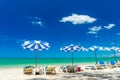 sun lounger and umbrella at White Sand Beach Royalty Free Stock Photo