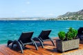 Sun loungers on the pier. Nice view of Salamis island . in Greece