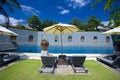 Sun loungers by poolside of resort hotel Royalty Free Stock Photo