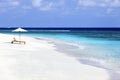 sun loungers on tropical beach maldives Royalty Free Stock Photo