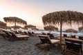 Sun loungers with umbrella on the beach, sunrise Royalty Free Stock Photo