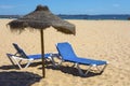 Sun Loungers and Umbrella on Beach Royalty Free Stock Photo