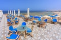 Sun loungers with umbrellas on the beach in Marsa Alam at sunrise, Egypt Royalty Free Stock Photo