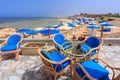 Sun loungers with umbrellas on the beach in Marsa Alam at sunrise, Egypt Royalty Free Stock Photo