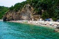 Sun loungers and umbrellas on the sandy Morgen beach located near the city of Budva. Montenegro Royalty Free Stock Photo