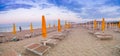 Sun loungers and umbrellas at seaside resort