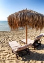 Sun loungers under beach sunshade Royalty Free Stock Photo