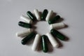 Sun made of green multivitamins and white magnesium capsules Royalty Free Stock Photo