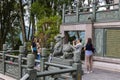 Sun Moon Temple, Taiwan - May 24, 2023: Chinese tourists at Wenwu Temple excitedly capture moments, snapping photos amidst the