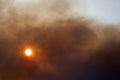 Sun obstructed by a cloud of smoke Royalty Free Stock Photo