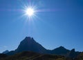 The sun over the Midi d`Ossau peak in the Pyrenees National Park. Royalty Free Stock Photo