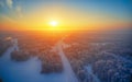 Sun over siberian forest under the snow at morning time. Siberian rural winter sunrise landscape with birch trees covered with Royalty Free Stock Photo