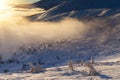 Sun over winter mountains, covered with snow. Royalty Free Stock Photo