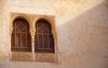 Sun partly lights ornate moorish windows. The Alhambra, Granada. Royalty Free Stock Photo